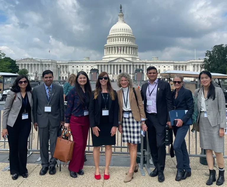 group in front of state building