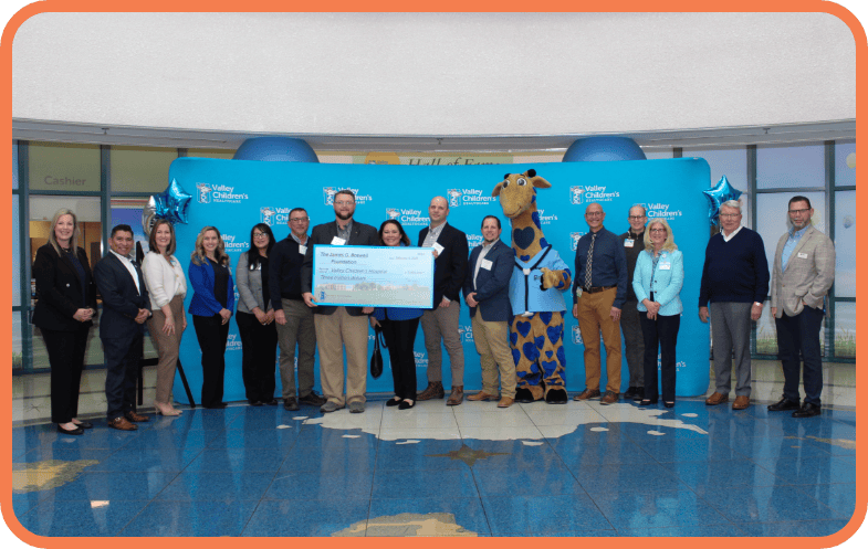 A group photo of the check presentation from the Boswell Company