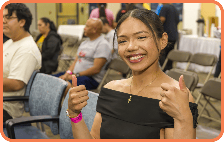 A third recipient of a scholarship smiles