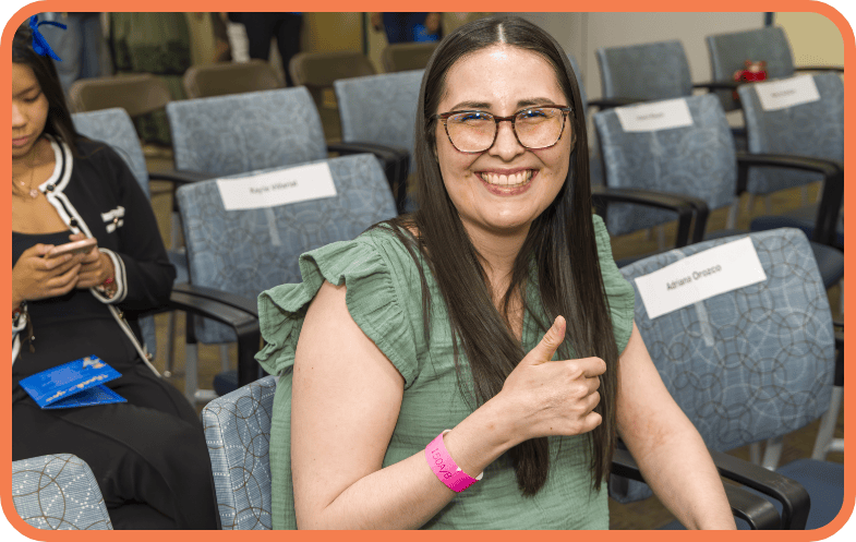 A second recipient of a scholarship smiles