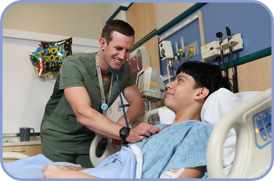 A PA listens to a young patient's heartbeat with a stethoscope