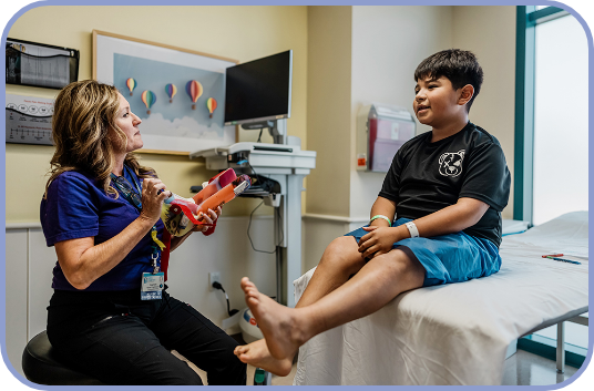 An orthopaedic provider consults with a young patient