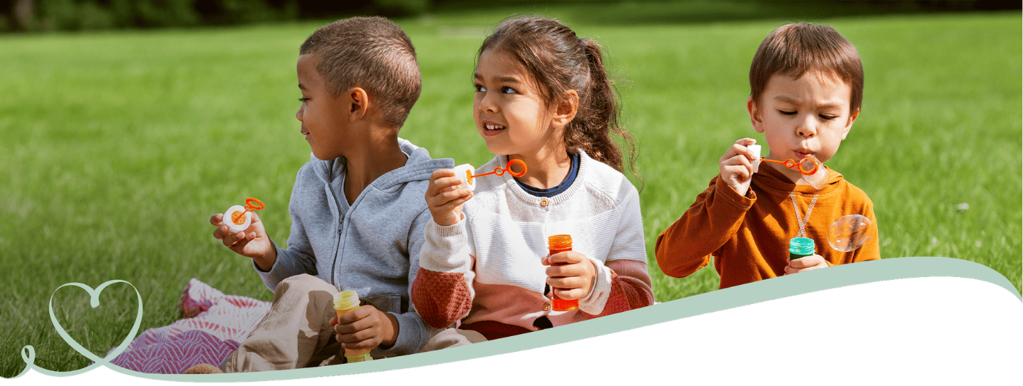 Children blow bubbles