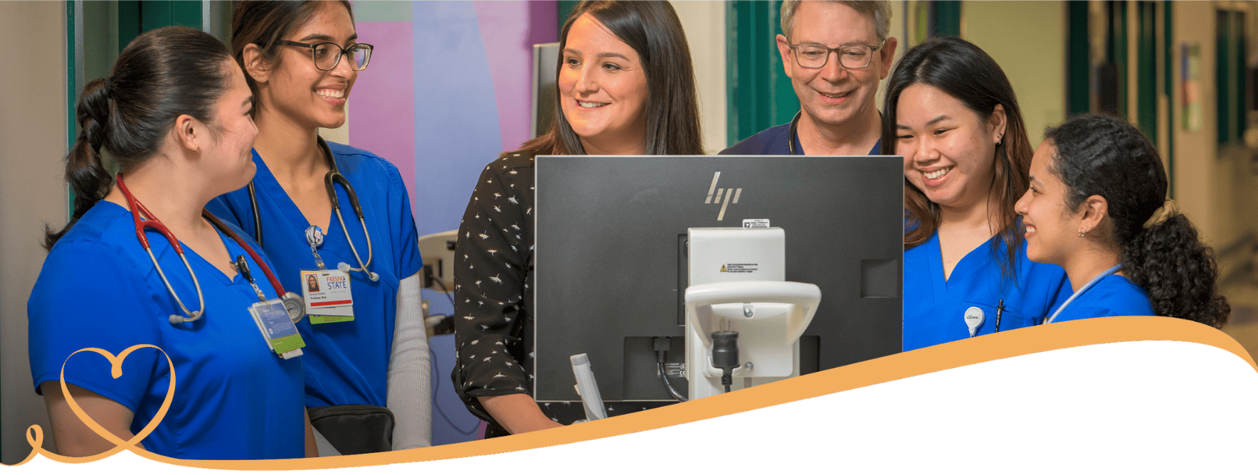 A group of nurses speak together