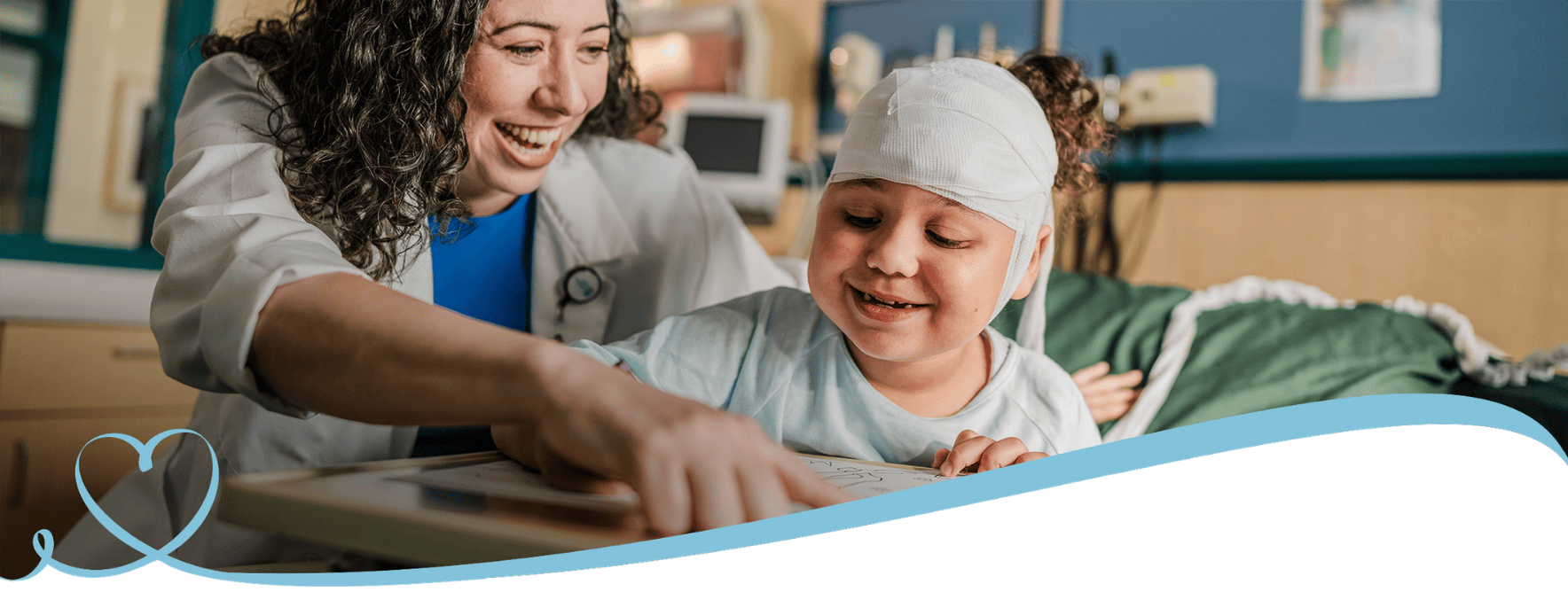 A little girl and doctor smile