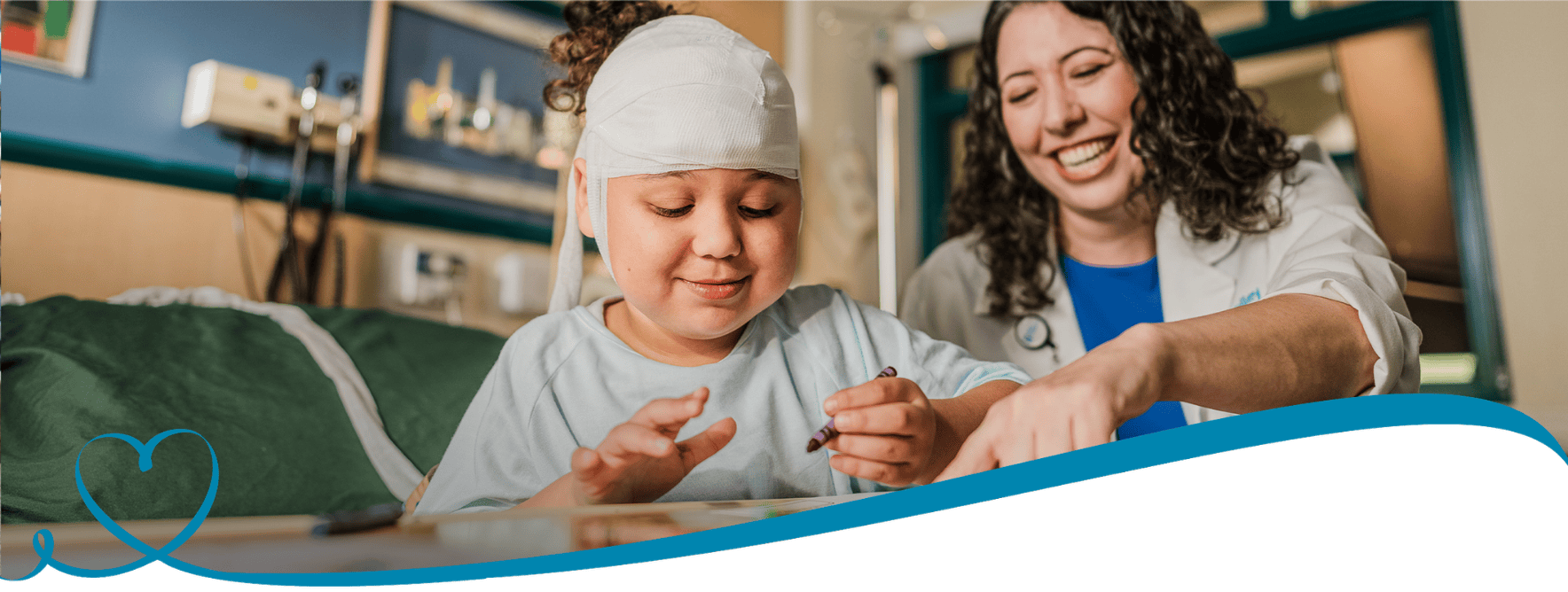 A doctor sits with a patient