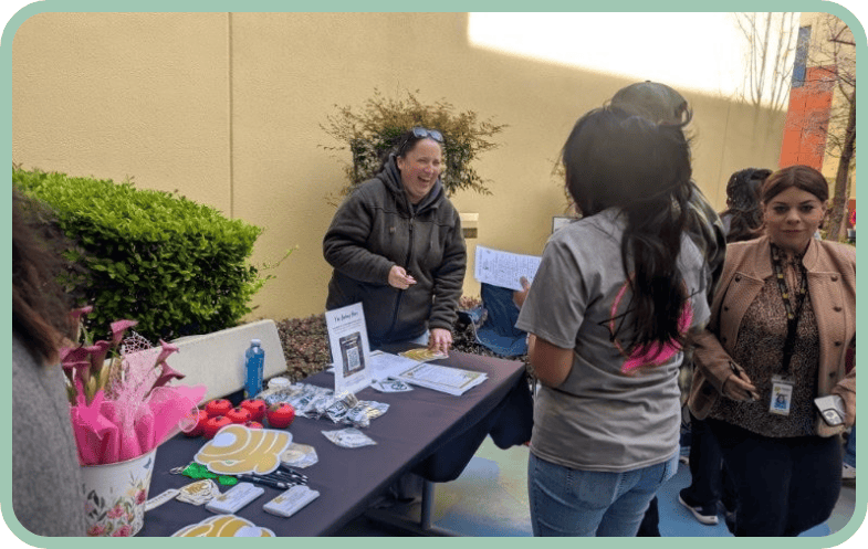 Conference participants visit a booth