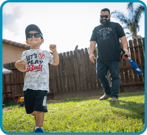 Royce and his dad play outside