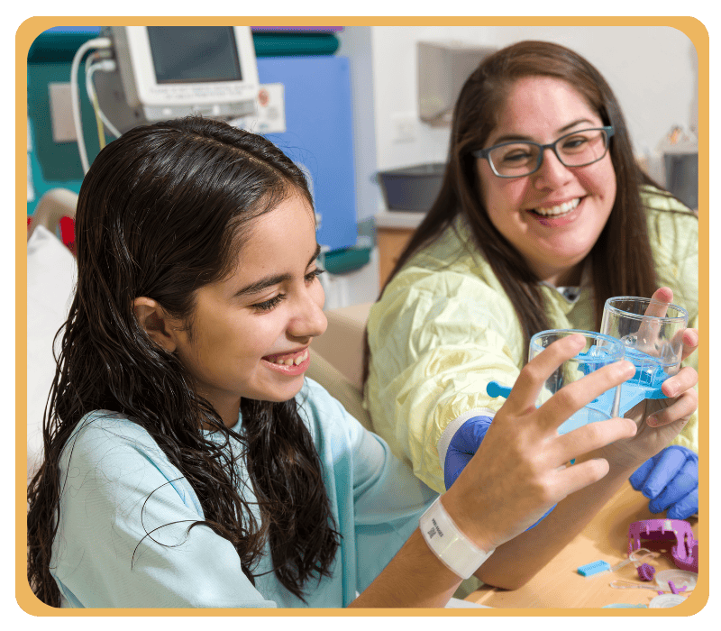 A Child Life specialist interacts with a patient