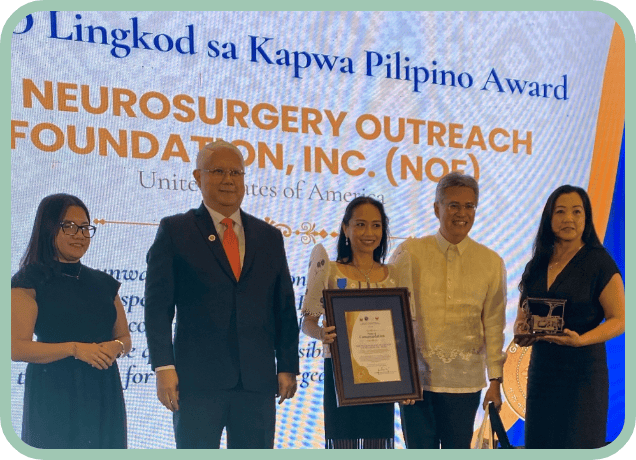 Dr. Patricia Quebada Clerkin accepts her award