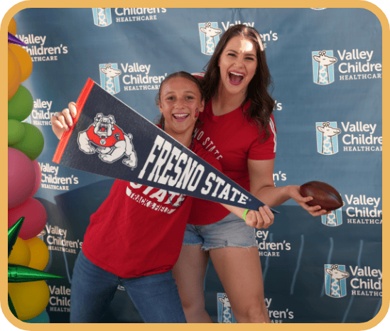 Participants at a Valley Children's tailgate smile